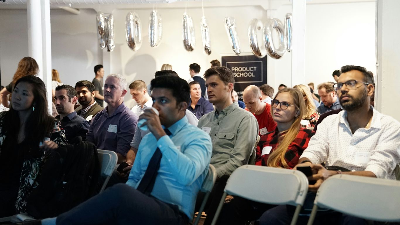 group of people inside white room