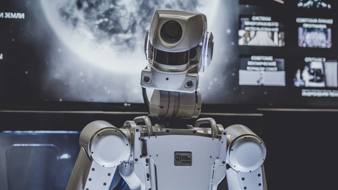 A robotic sensor array displays digital data.