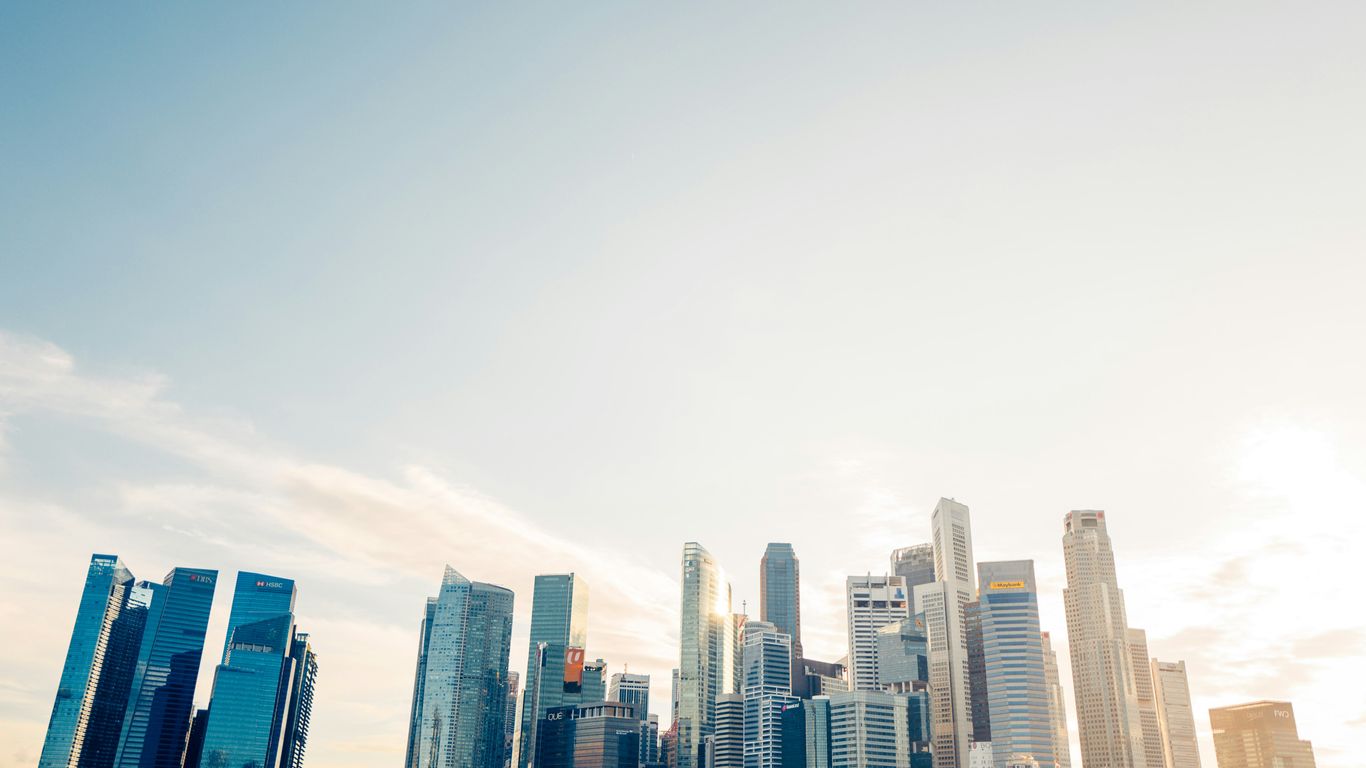 a large body of water with a city in the background