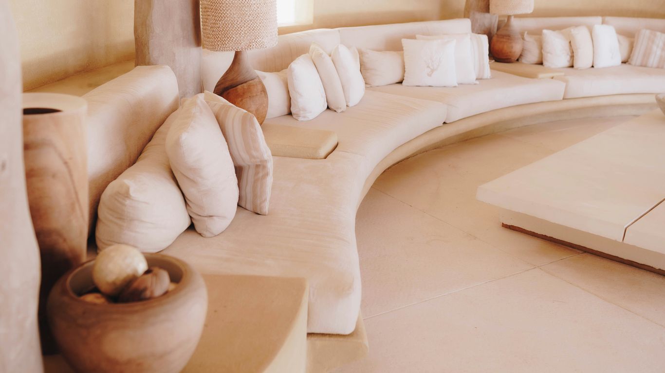 Sculptural travertine table in living room
