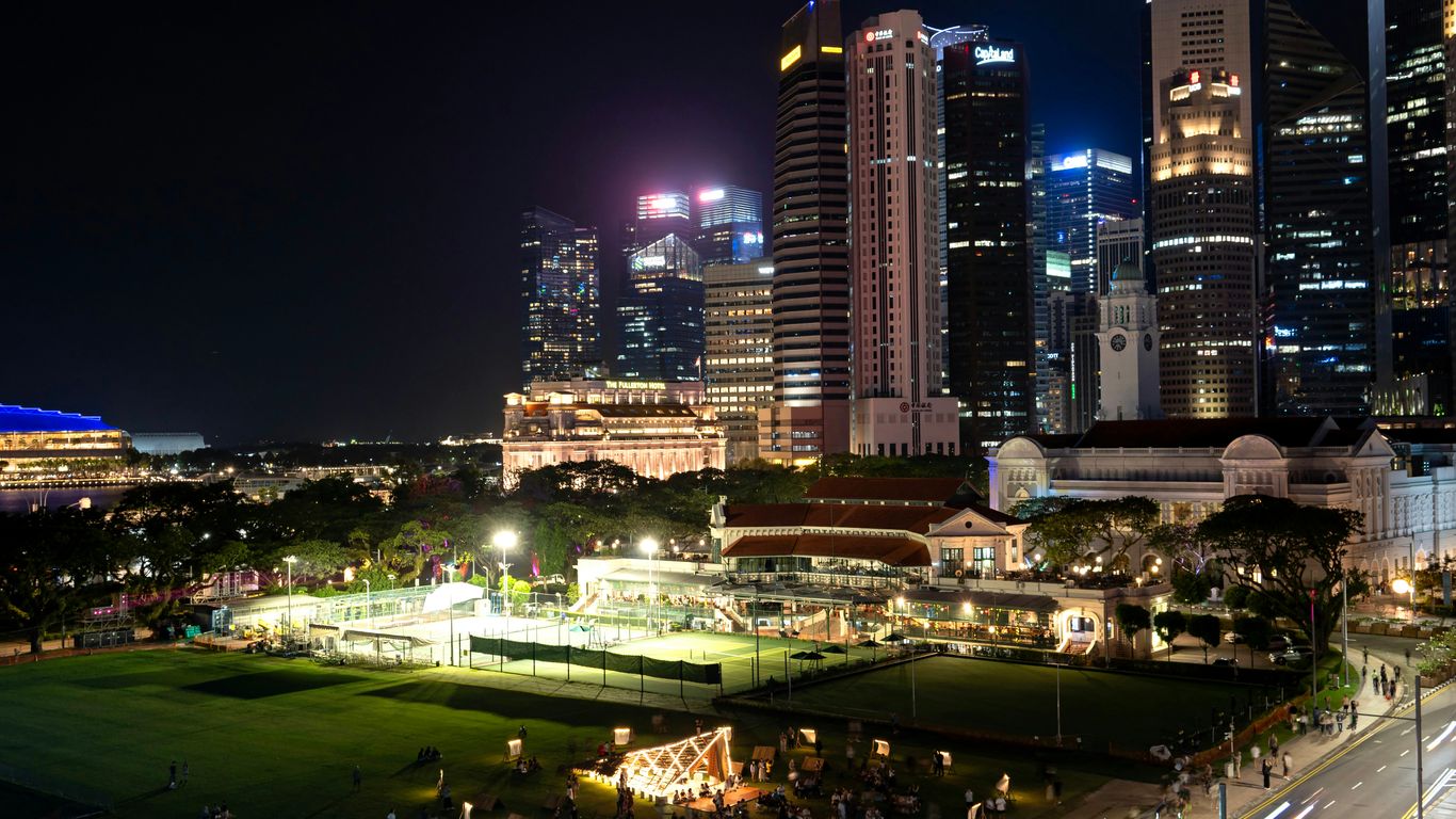 Vibrant cityscape with illuminated buildings at night