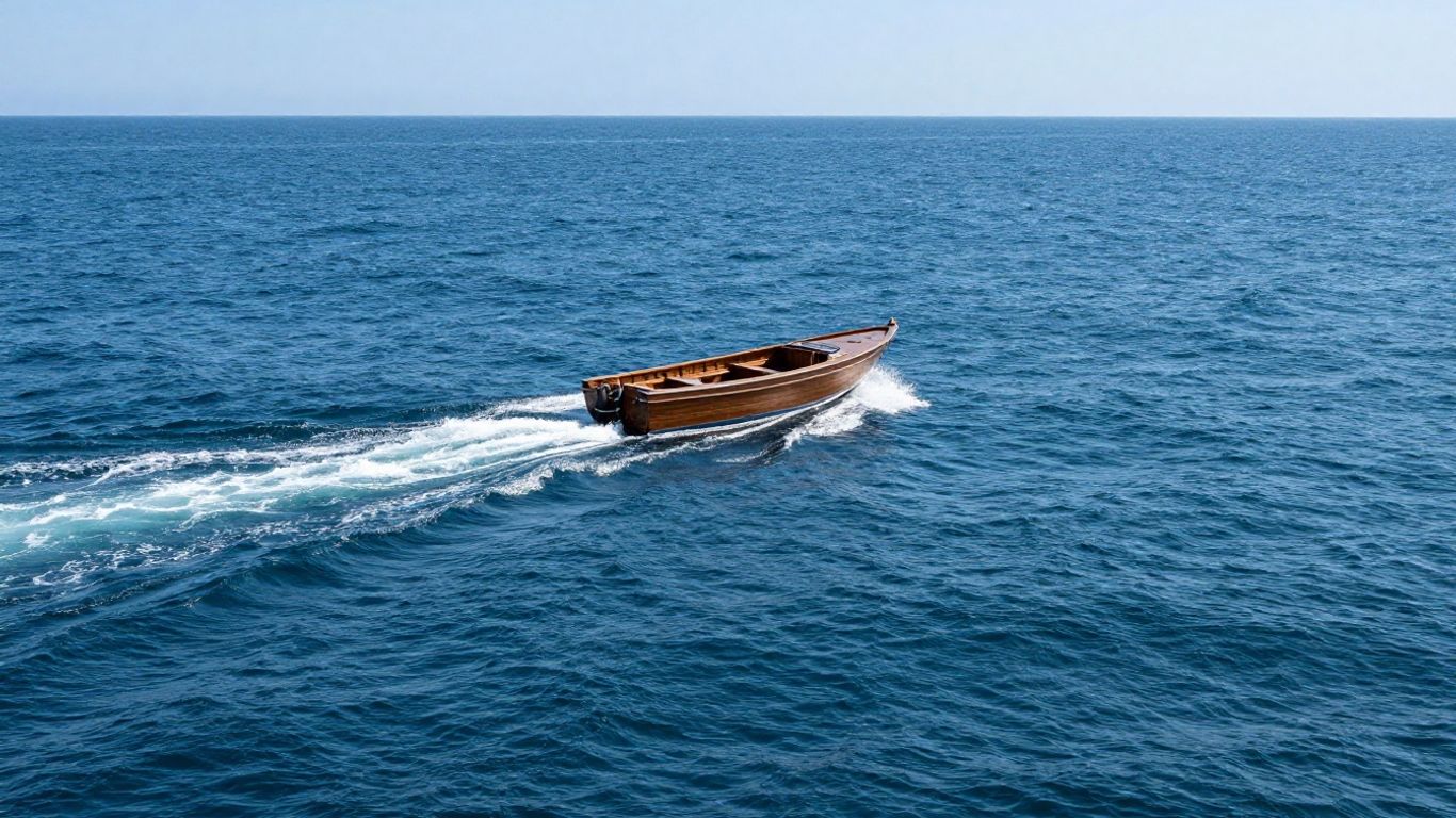 Boat traveling through blue waters