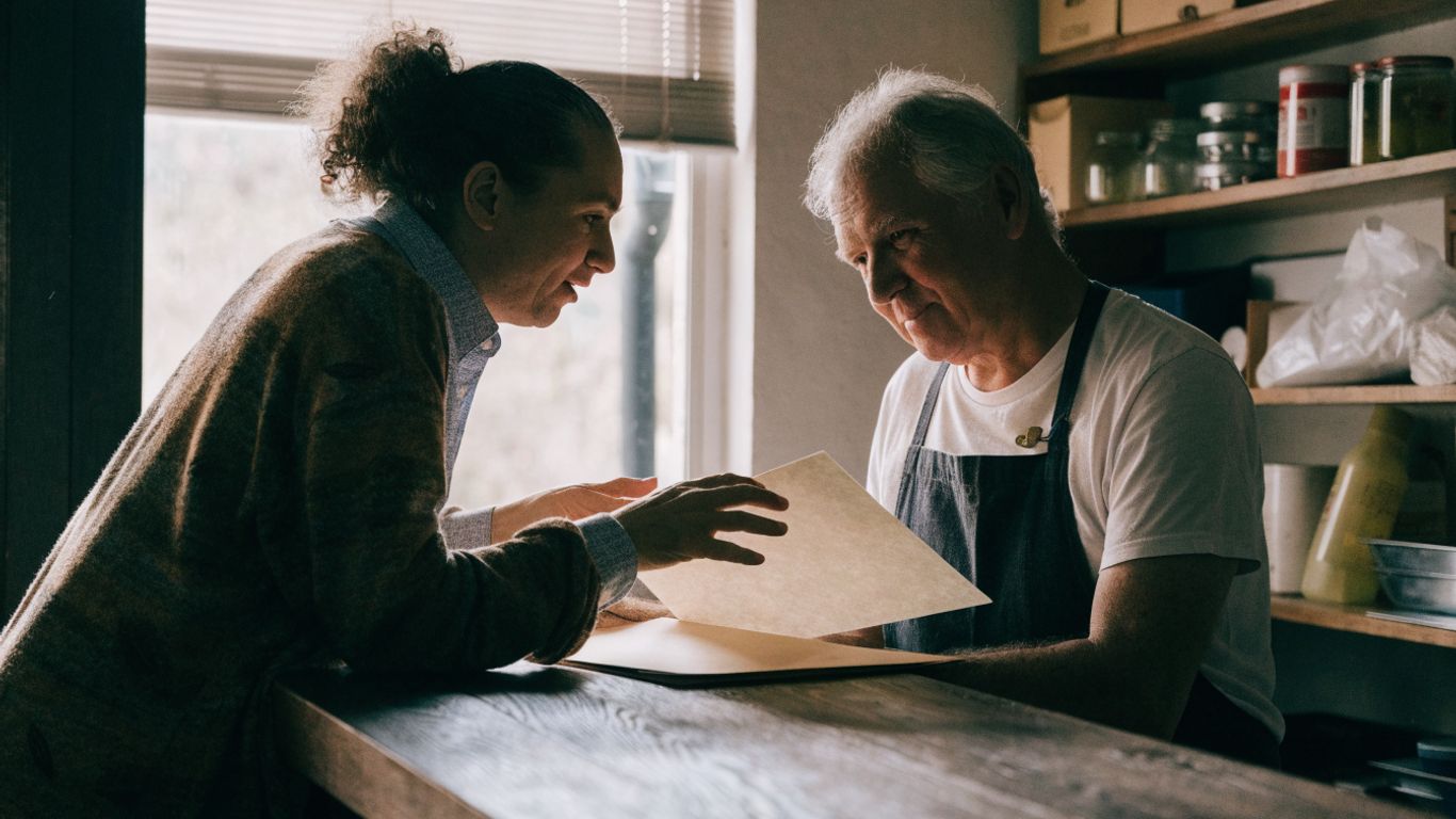 Customer reviewing business details at a neighborhood counter