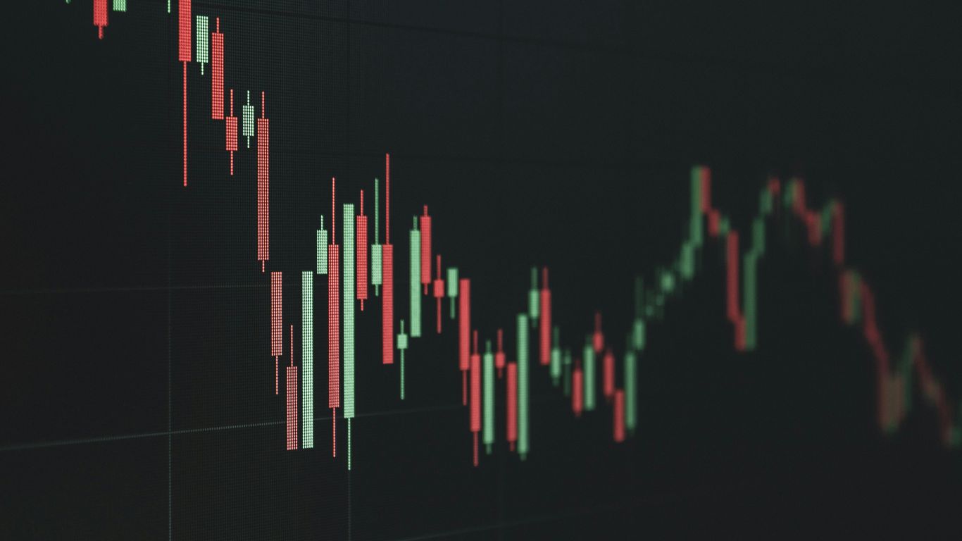 Stock market chart shows a declining trend.