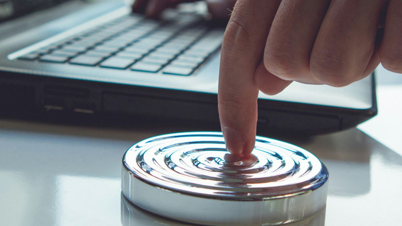 person holding clear glass round lid