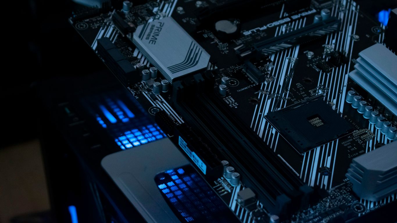 A computer motherboard with glowing blue lights.