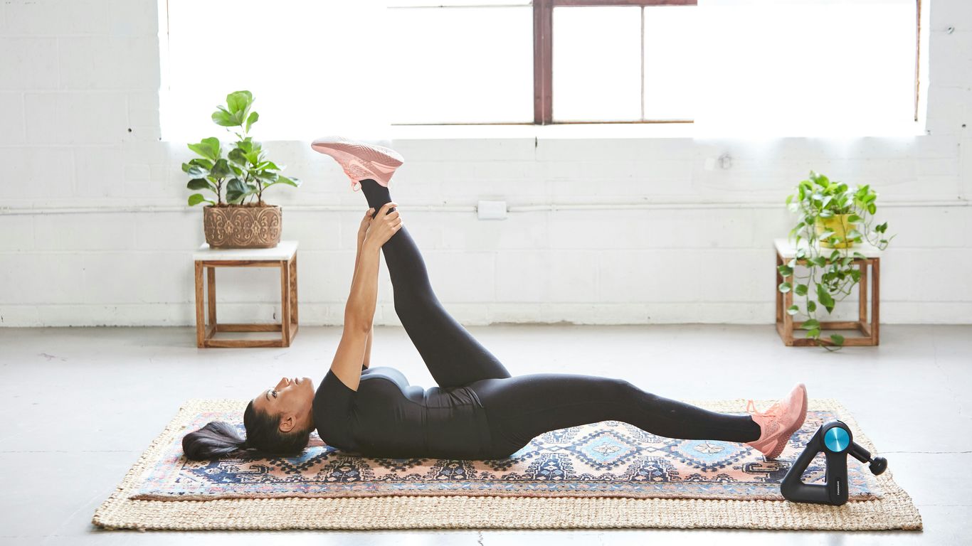 Stretching with a yoga strap