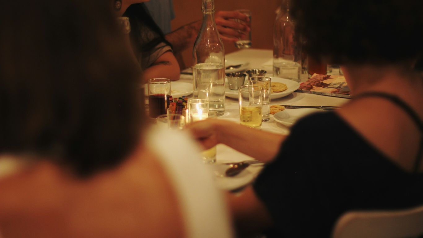 People eating at a local wooden table setup
