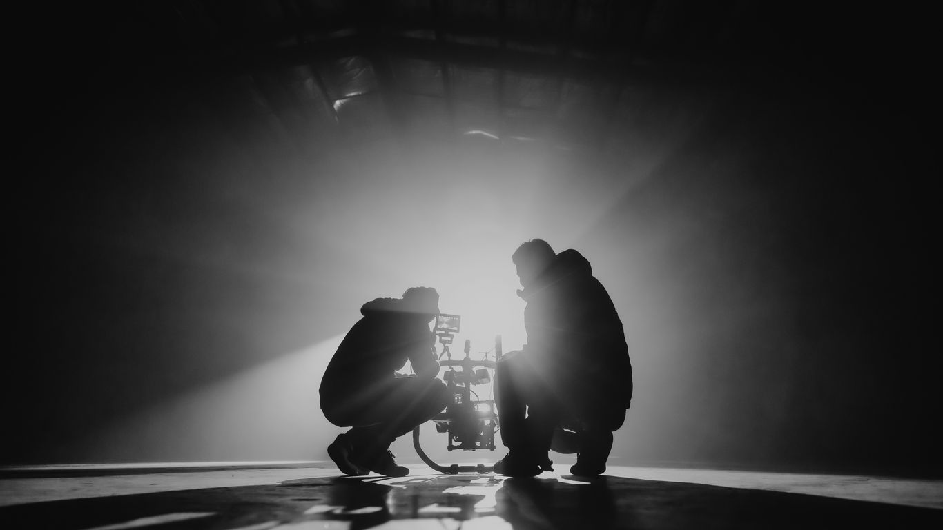 Video production team reviewing a project together