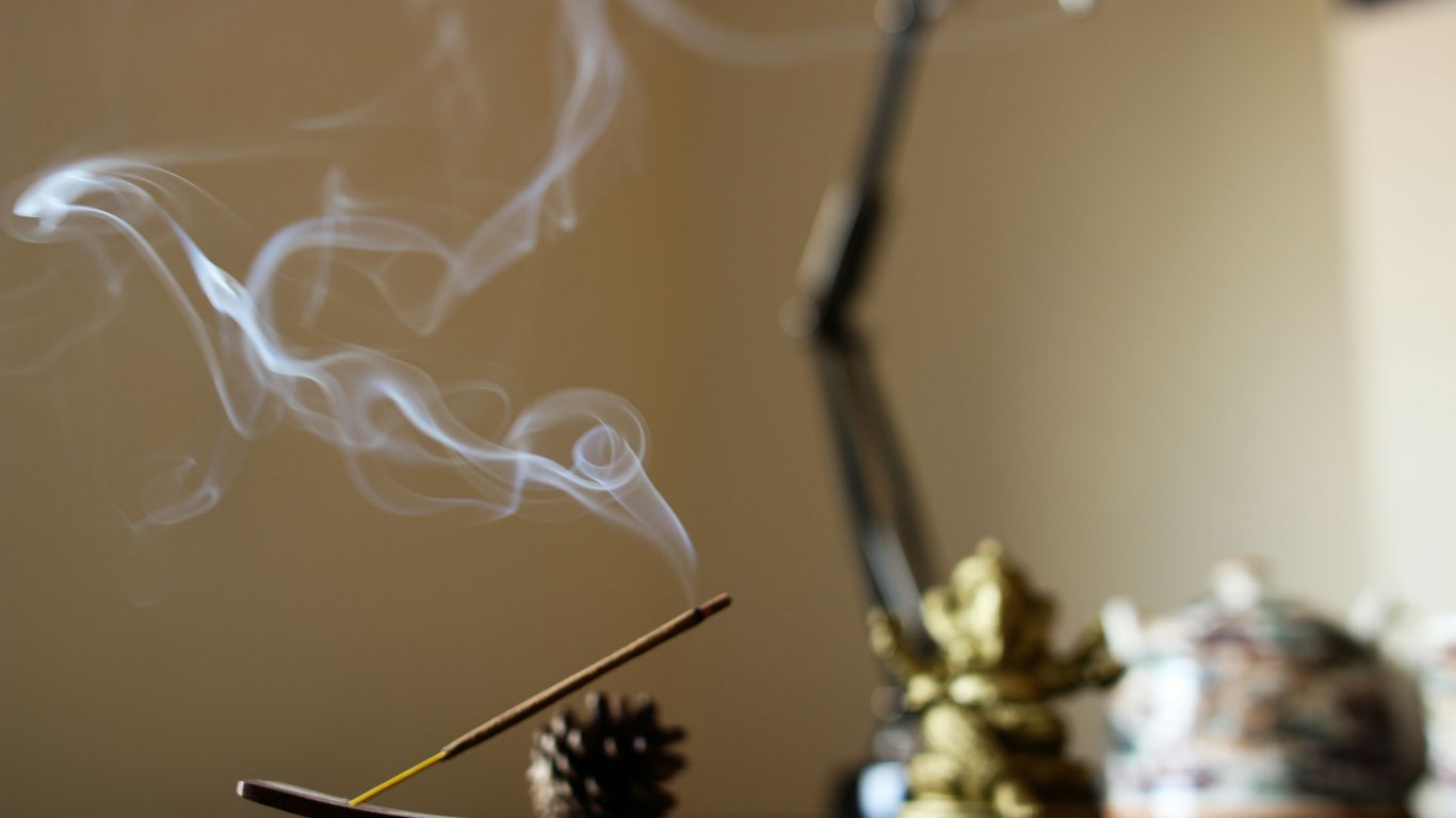 Incense burning ritual and temple atmosphere