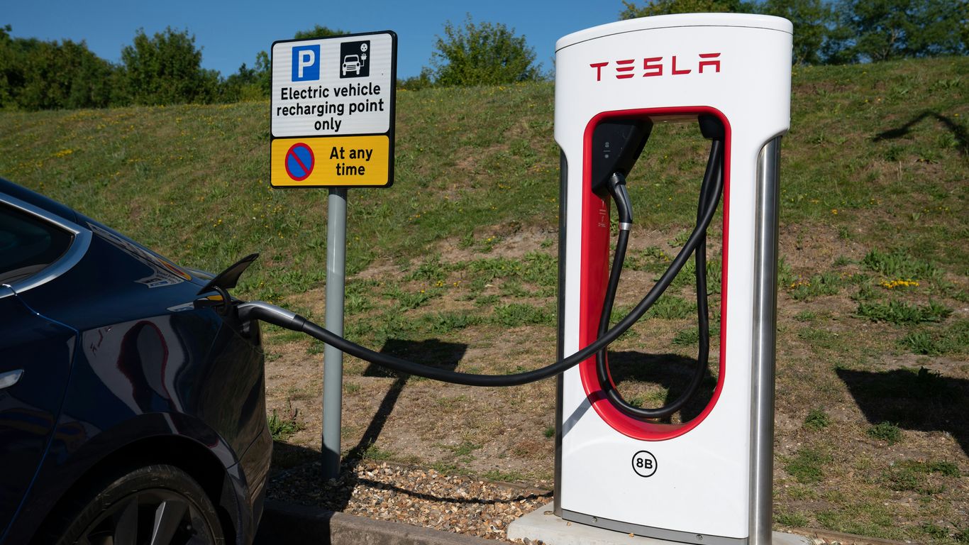 Tesla charging station with electric car connected.