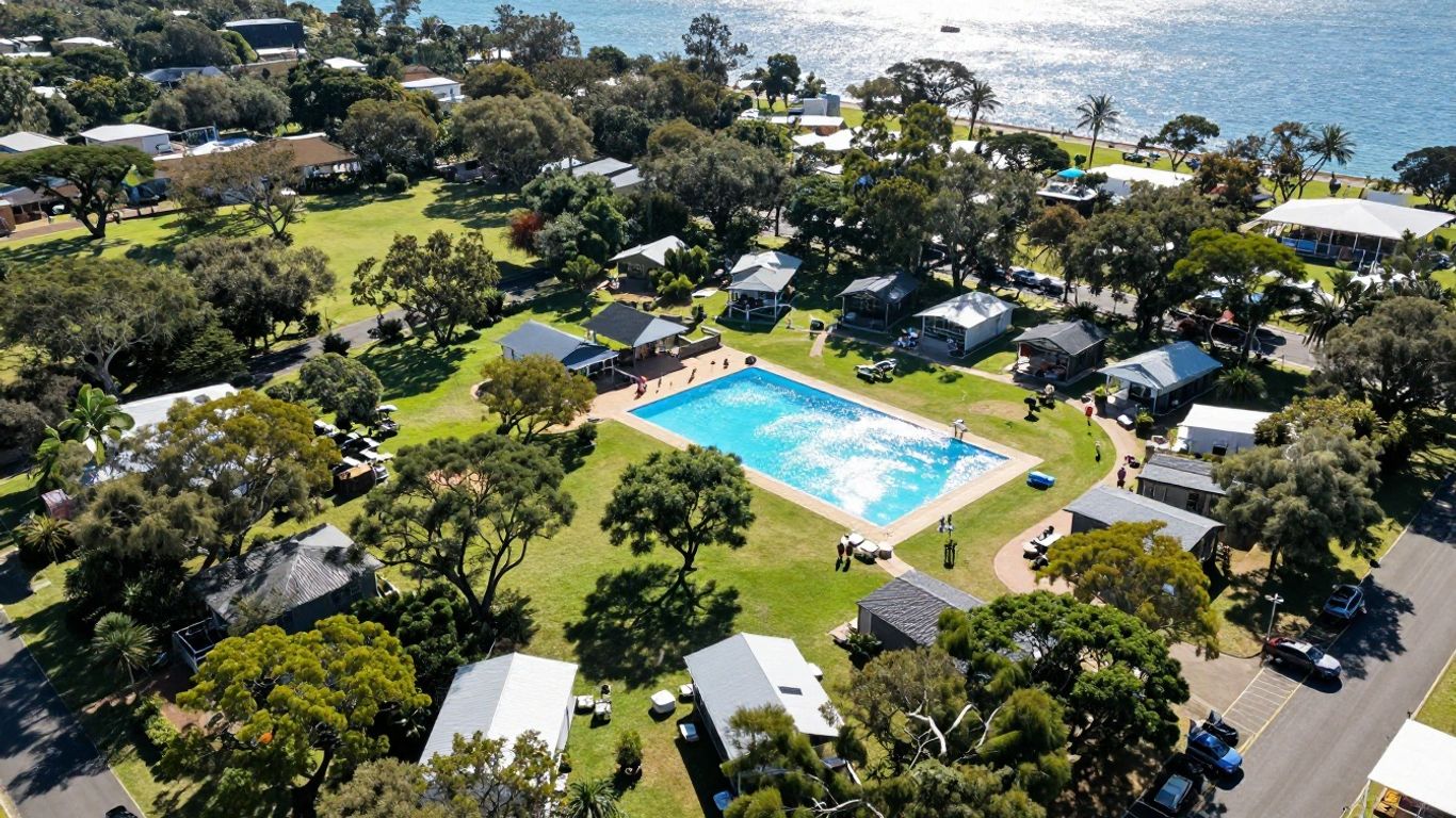 Big 4 Gold Coast Holiday Park aerial view with pools and cabins.