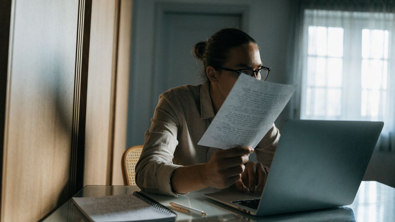 Trader reviewing account rules at a desk
