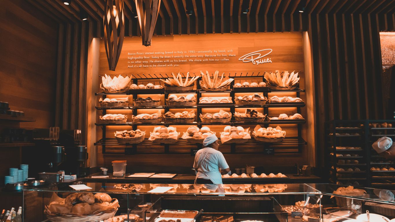 Modern cafe counter with fresh baked pastries