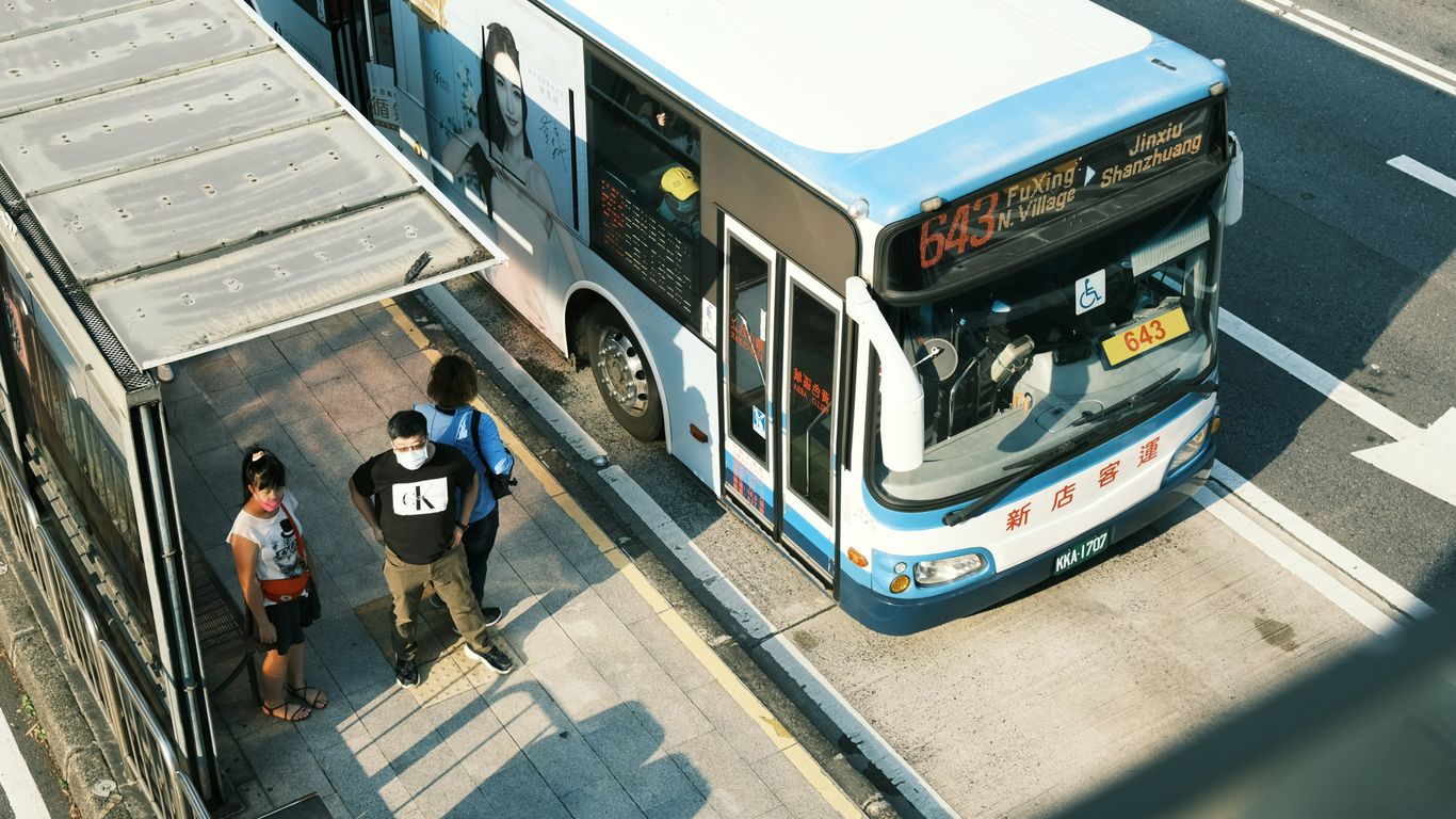 people boarding a bus