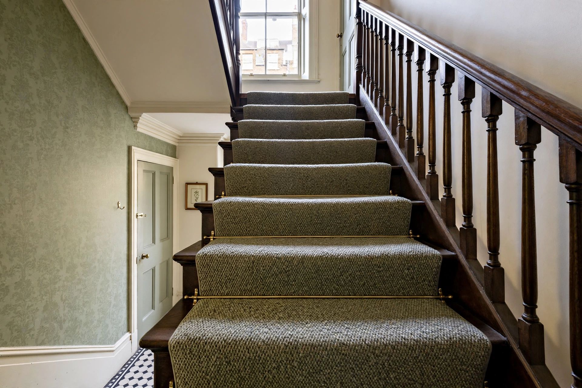 Dense twist carpet fitted neatly over the treads and nosings of a Bristol staircase