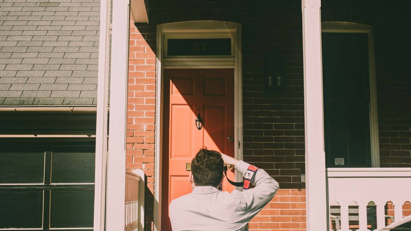 Surveyor inspecting a residential property