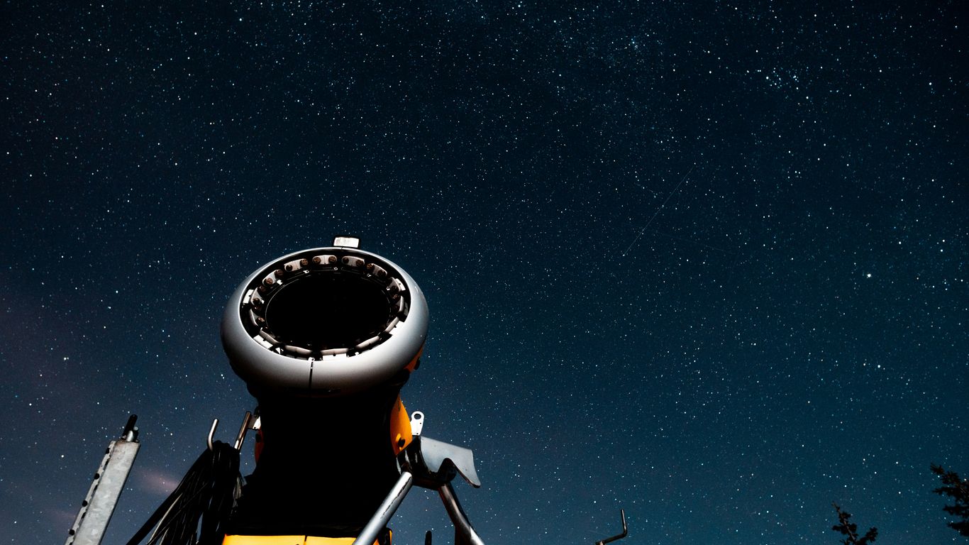white and black satellite under starry night