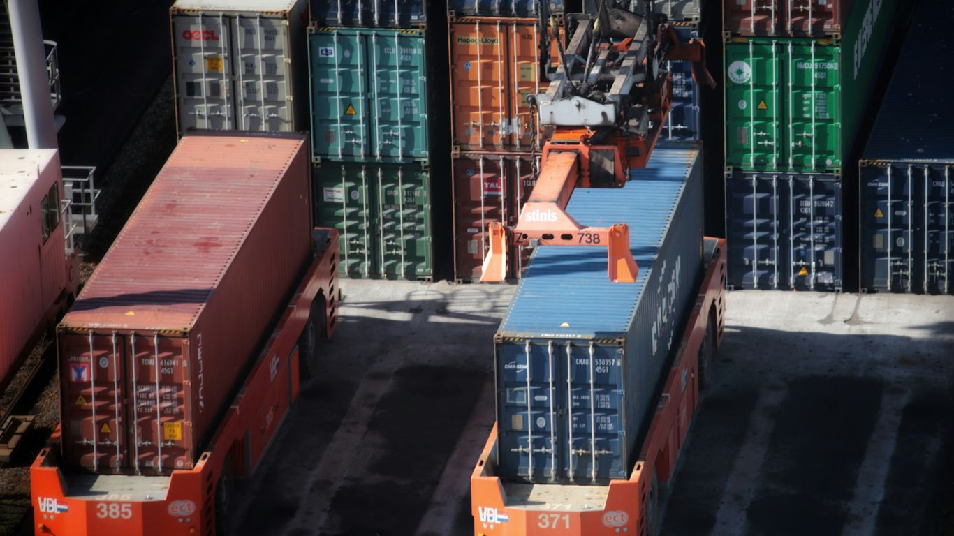 cargo containers are stacked on top of each other