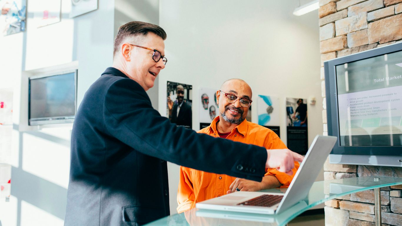 A professional salesperson working at their desk