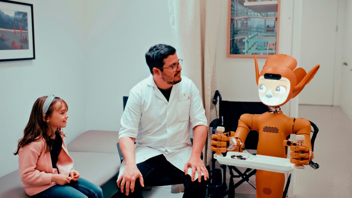 Doctor, girl, and robot in a medical room.