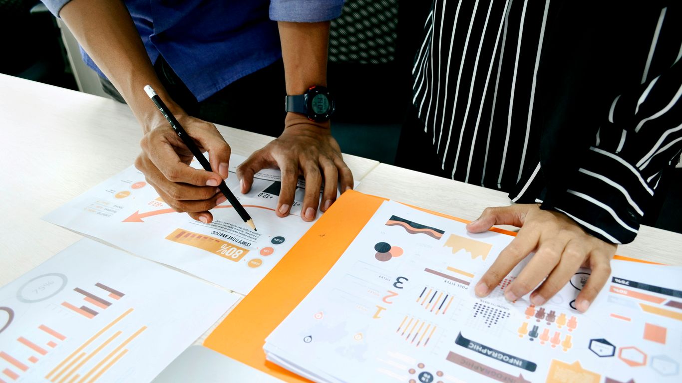 Professional strategy team analyzing data for client success
