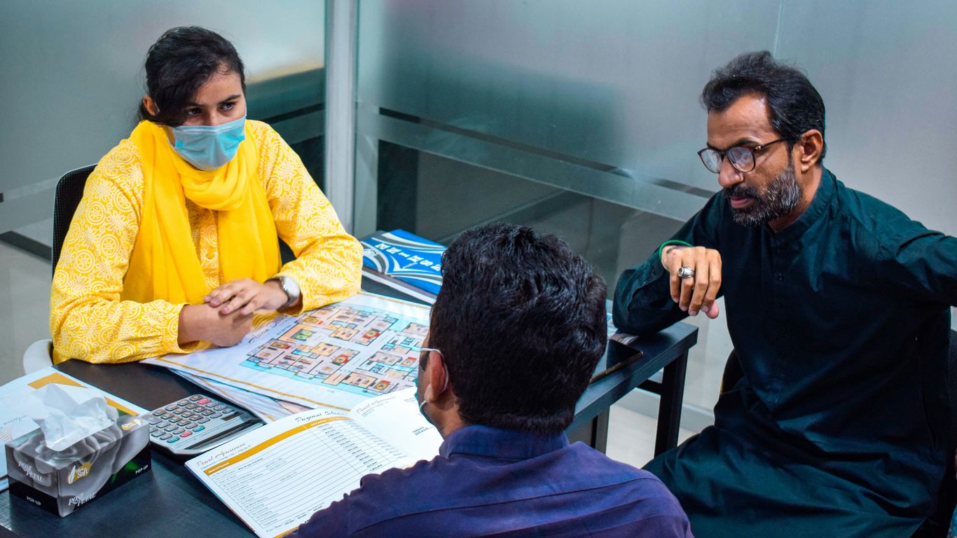 a group of people sitting around a table