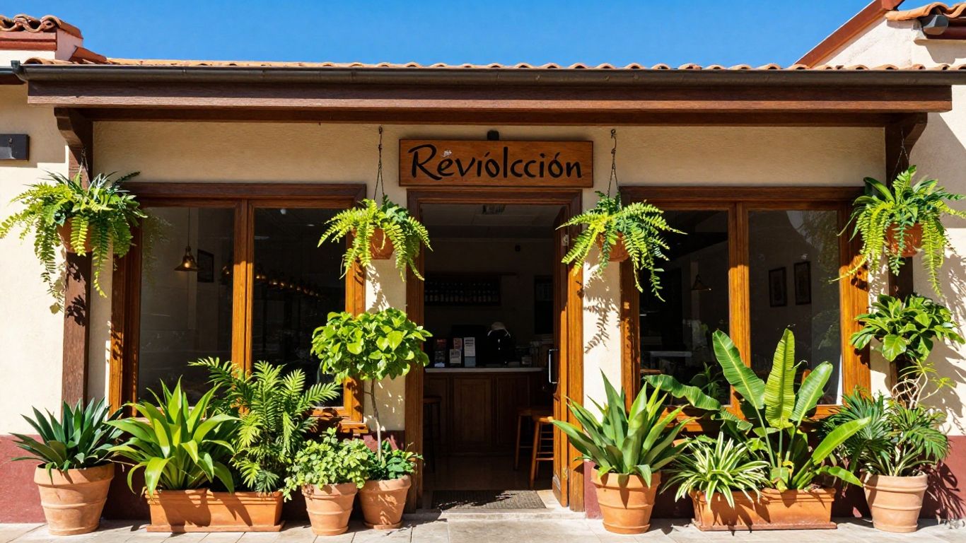 Cafe Revolucion exterior with plants and wooden door
