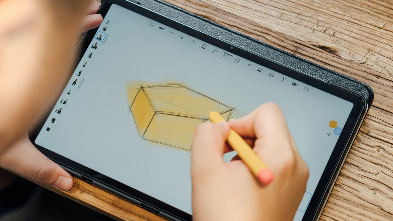 a person holding a tablet