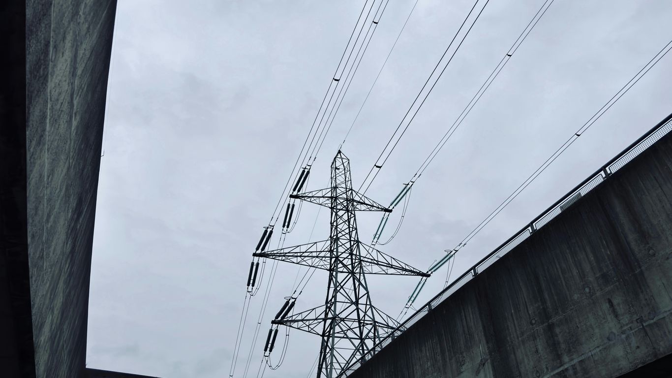 a high voltage power line on a cloudy day