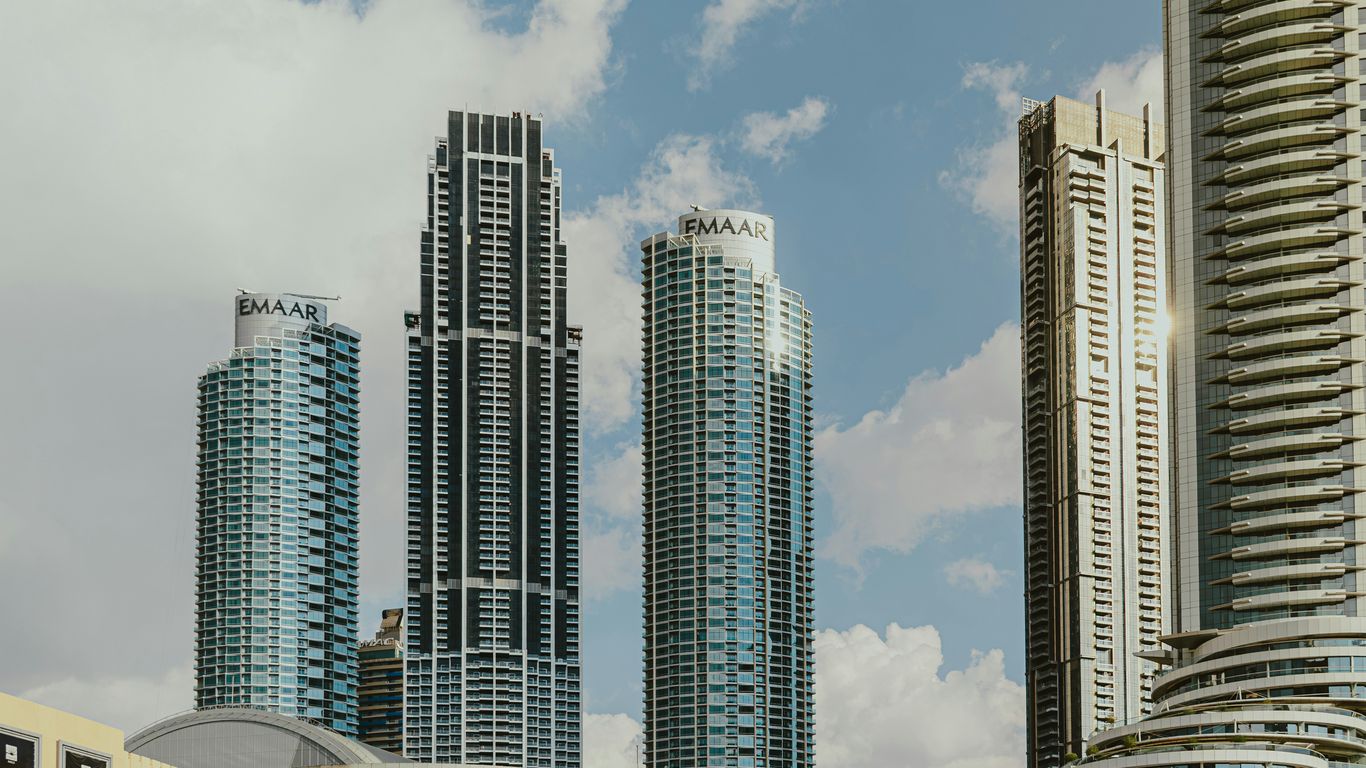 A group of tall buildings sitting next to each other