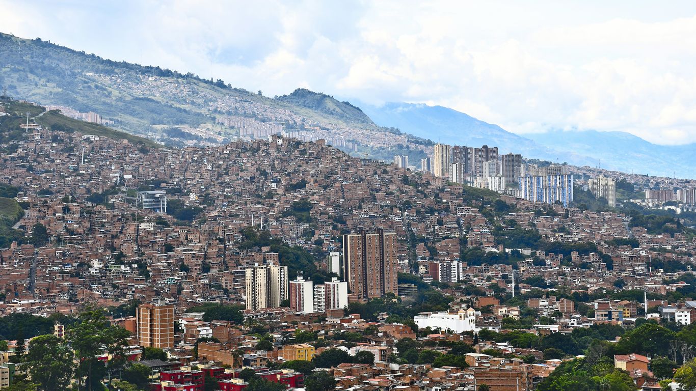 a city with mountains in the background