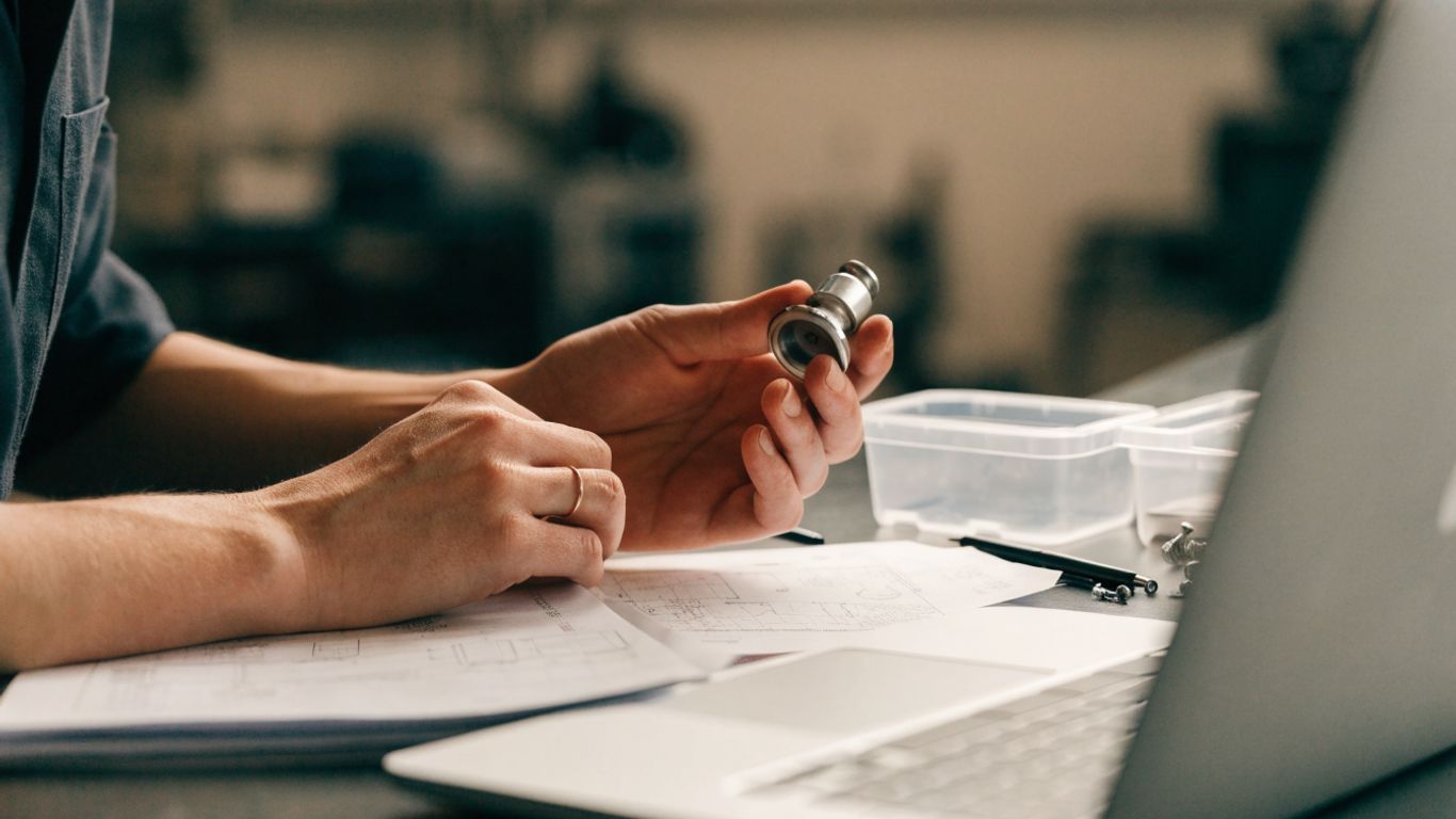 Parts specialist reviewing component and warranty paperwork