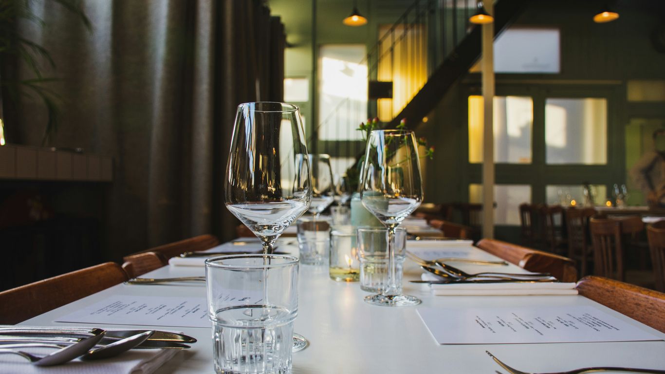 A clean table setting featuring a menu