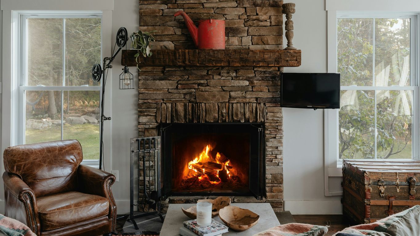 a living room filled with furniture and a fire place