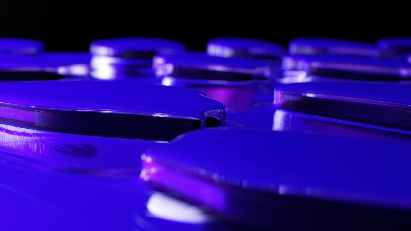 a close up of a purple object with a black background