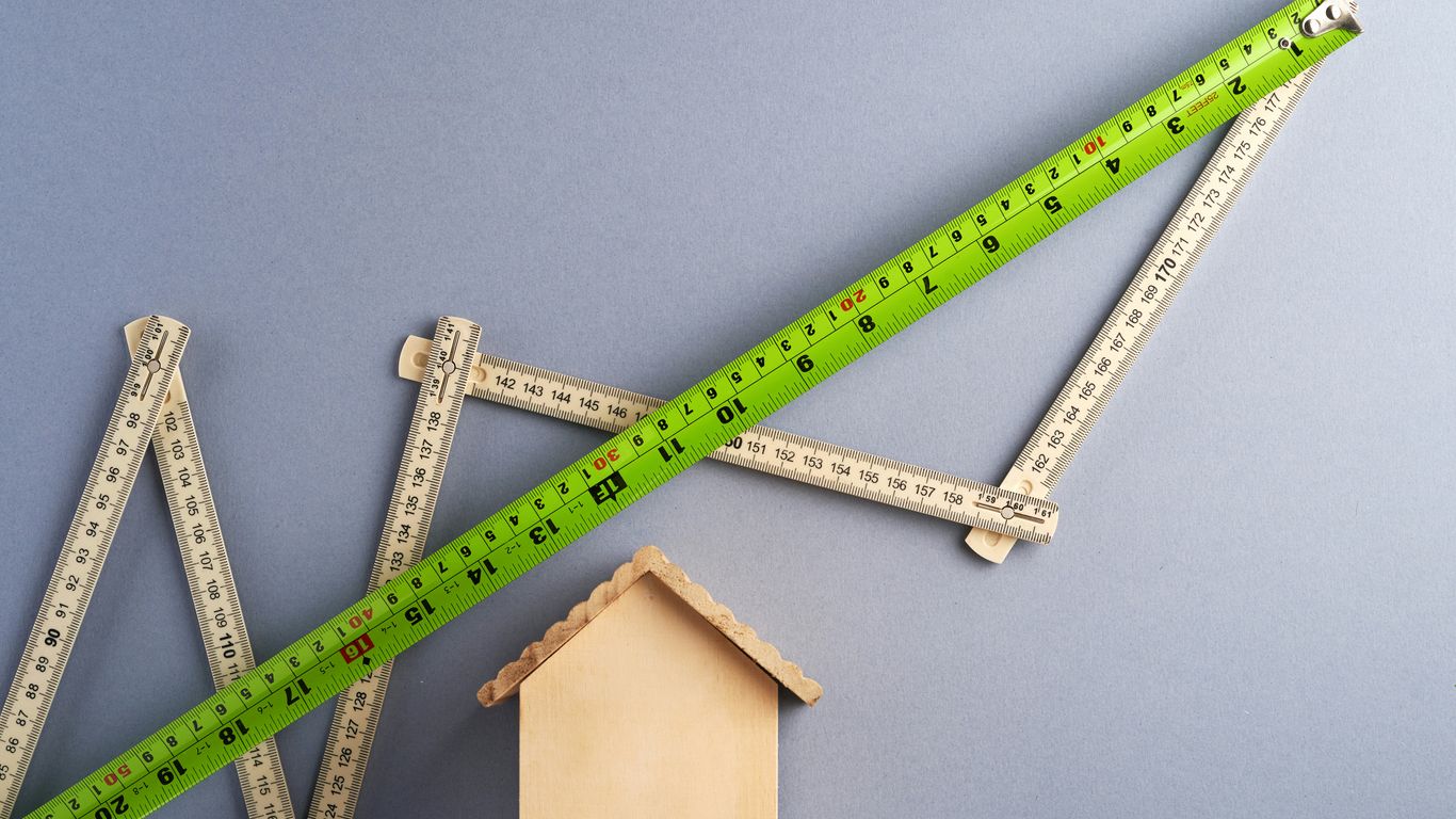 green ruler on white surface