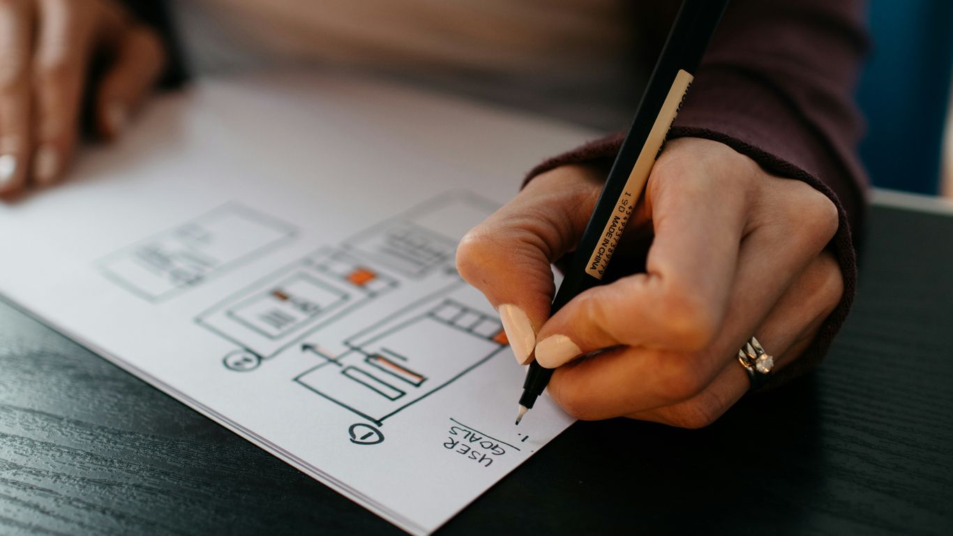 A designer reviewing plans with a client