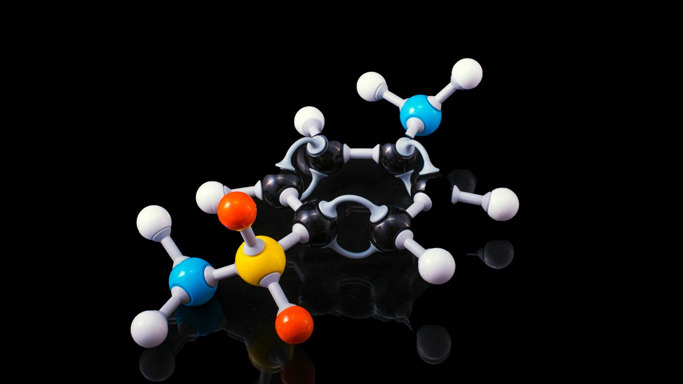 Researchers working with complex molecular models display