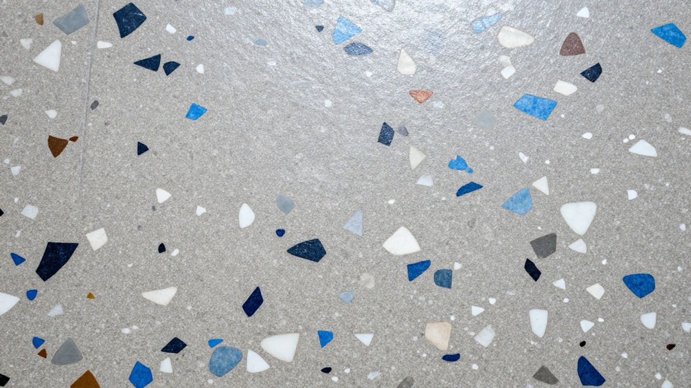 Polished terrazzo floor with colorful chips embedded in cement.
