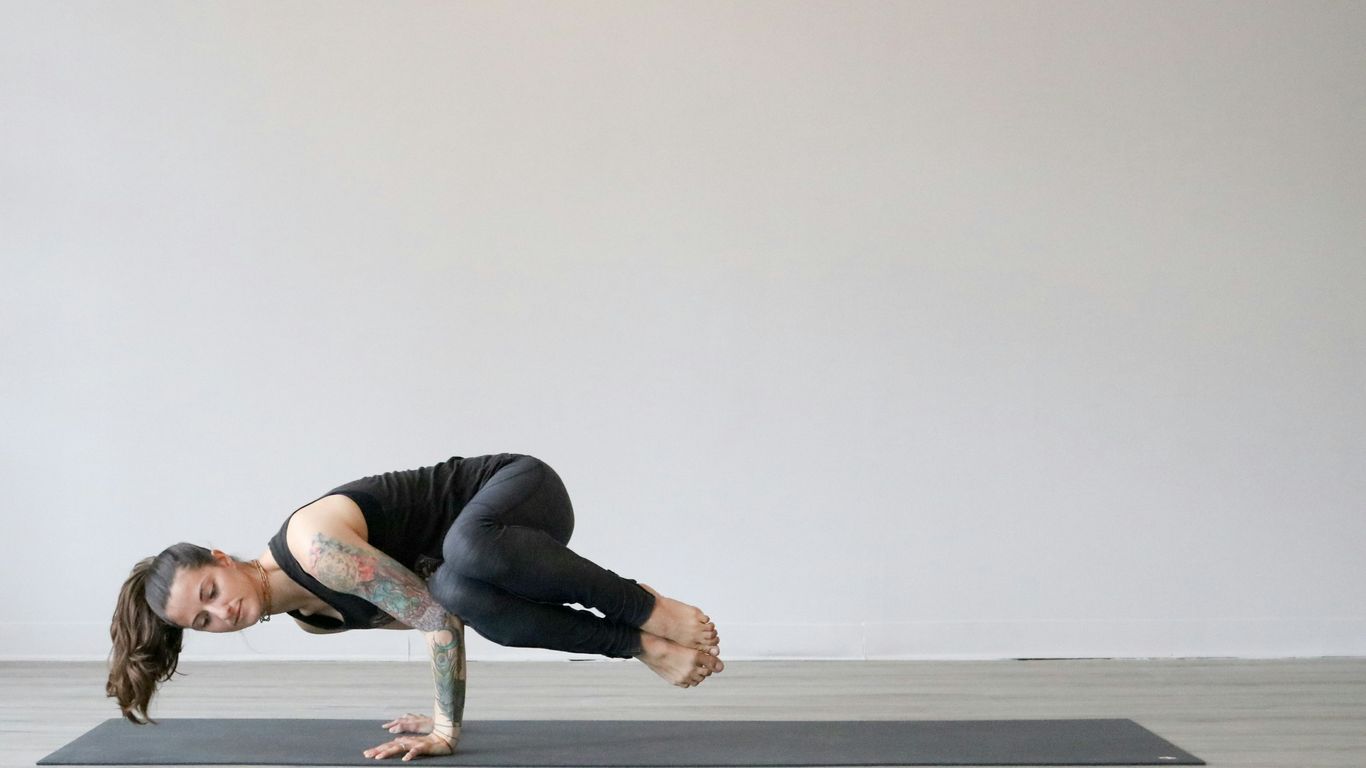 A yogi using foam blocks for support