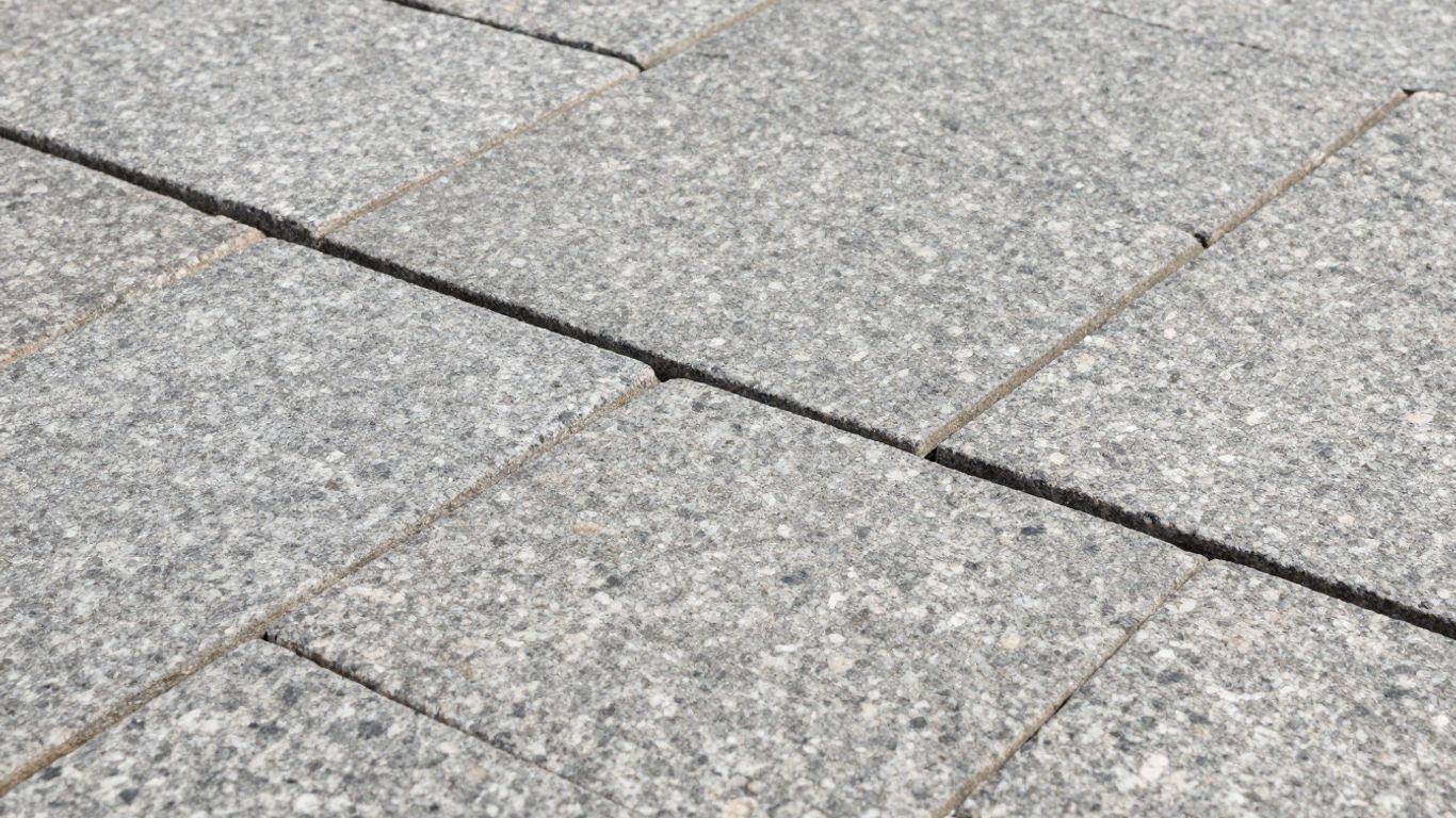 Durable grey paving granite laid in a patio.