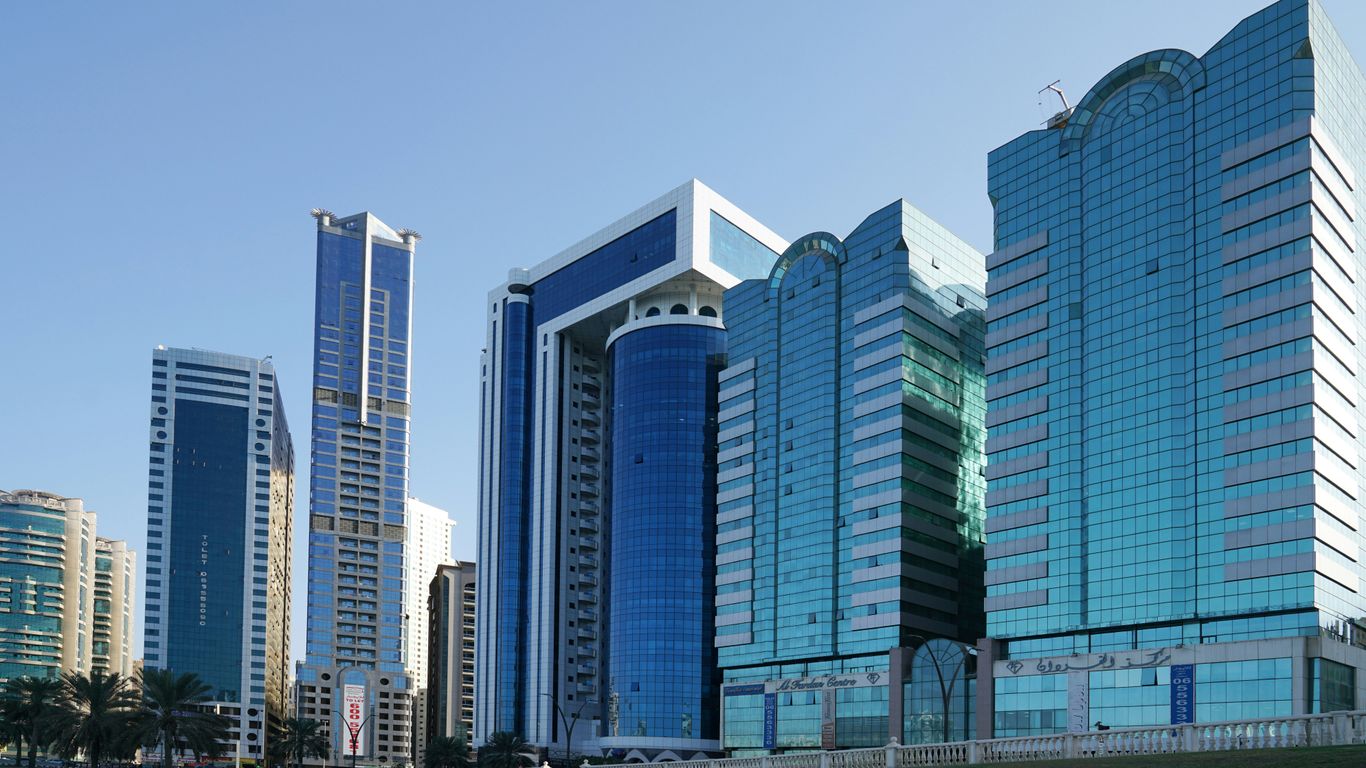 a group of tall buildings sitting next to each other