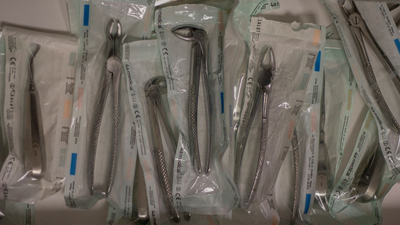 a bunch of forks and spoons in plastic bags