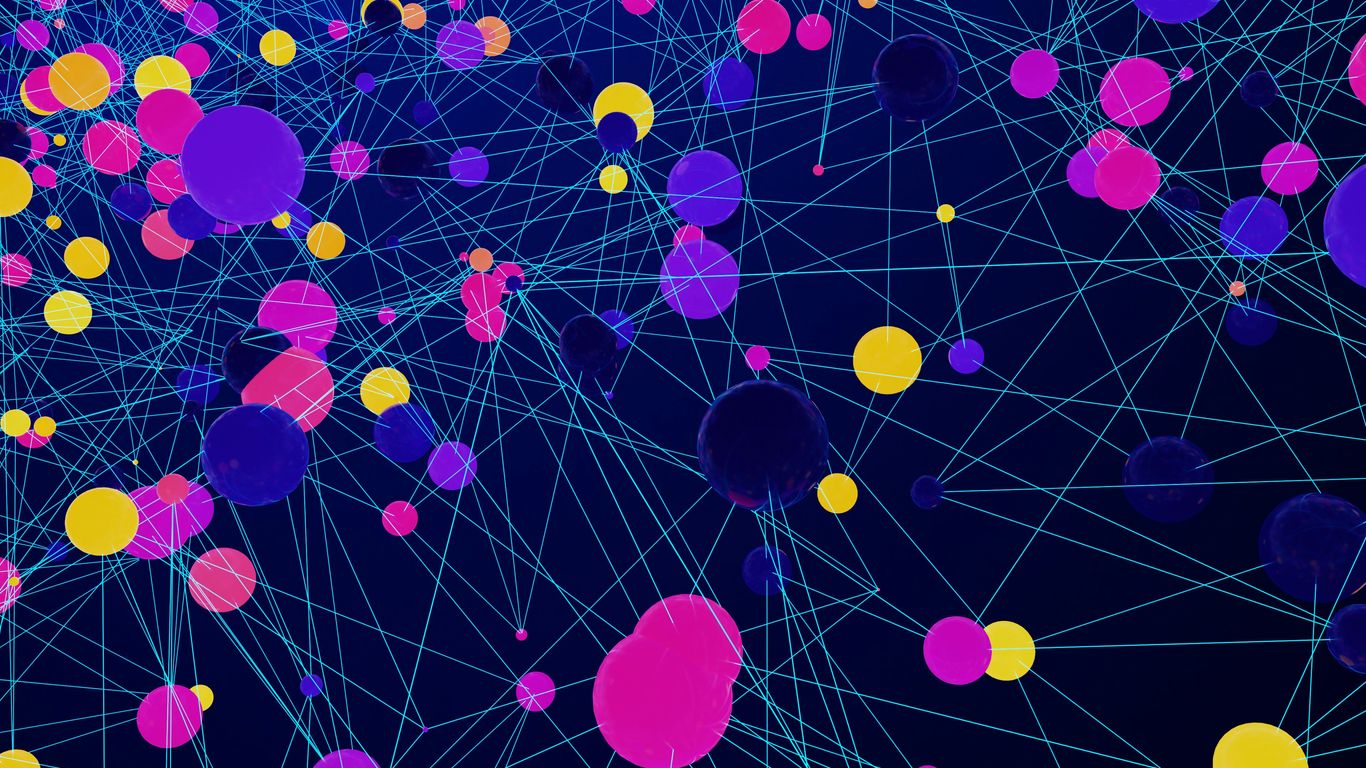 a large group of colorful balls floating in the air