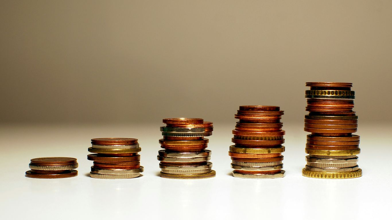 Stacks of coins increasing in height from left to right.