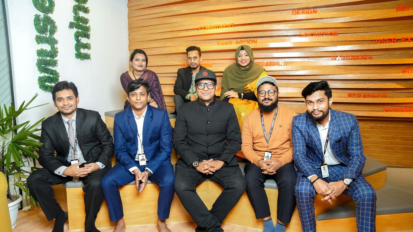 a group of people sitting next to each other