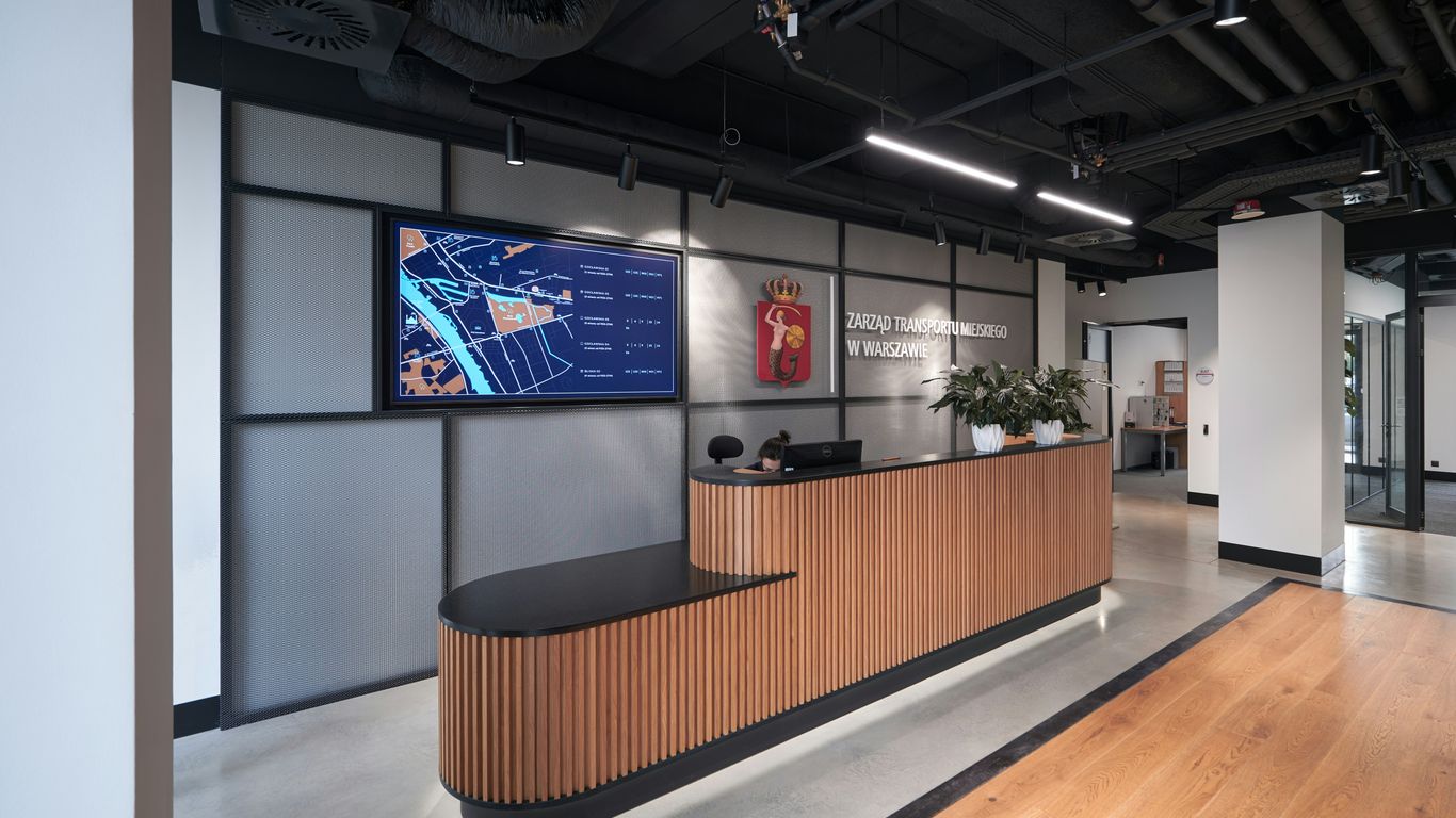 a reception area with a wooden reception counter