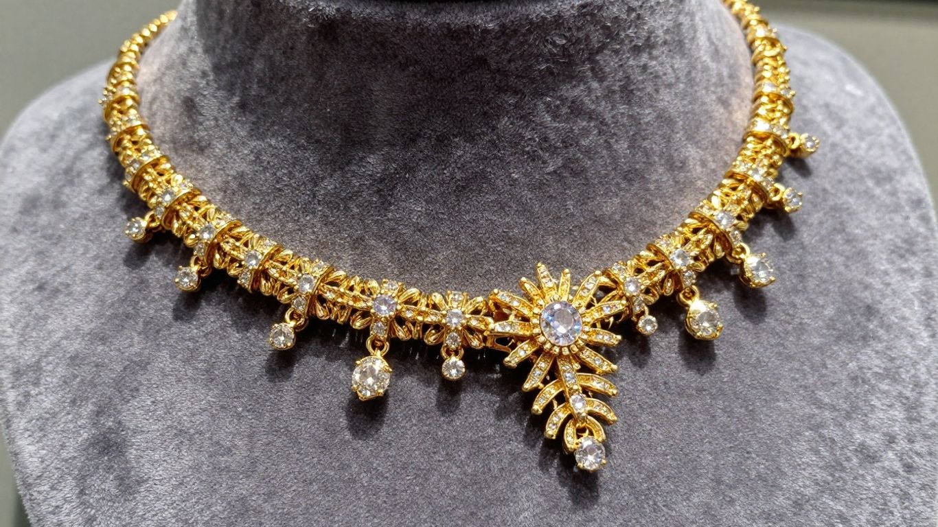 Intricate gold necklaces and diamond earrings.