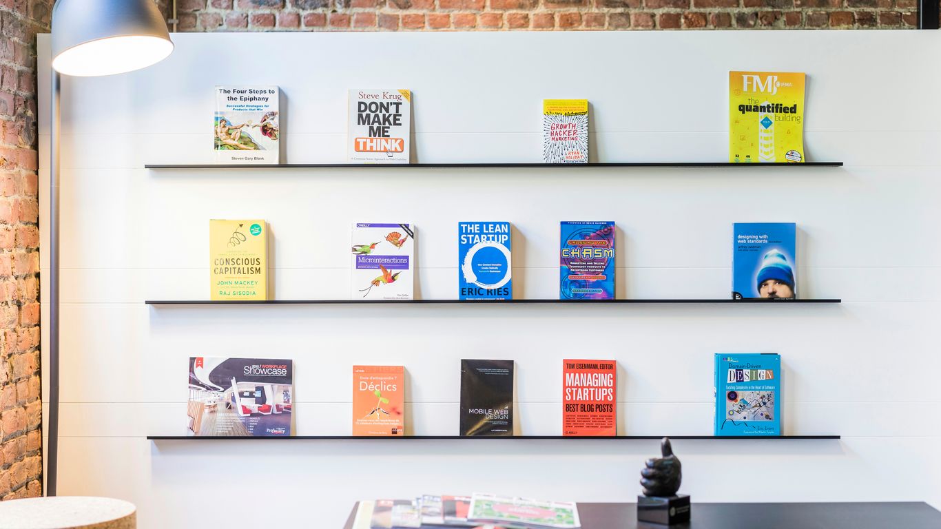 Home office shelves with organized binders